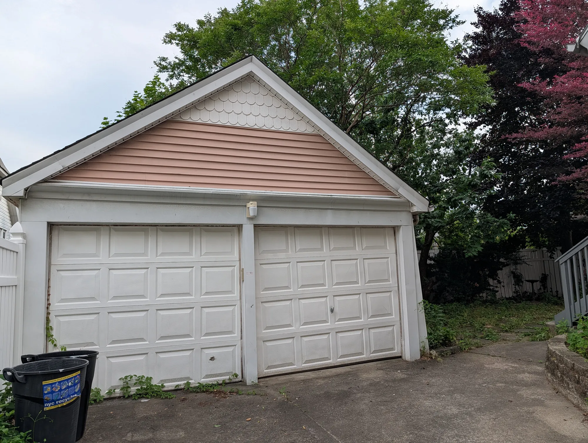 The two-car garage front with scalloped gable